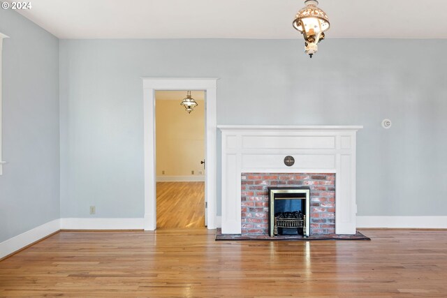 1706 Oak St, La Grande, OR 97850 - unfurnished living room with light wood-style floors, baseboards, and a fireplace