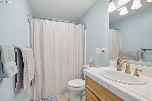 bathroom featuring tile patterned floors, toilet, and vanity