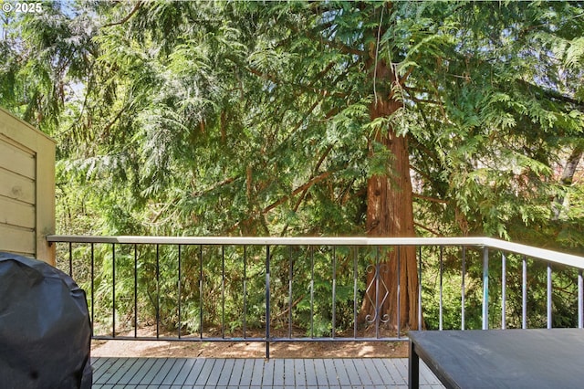 wooden deck with grilling area