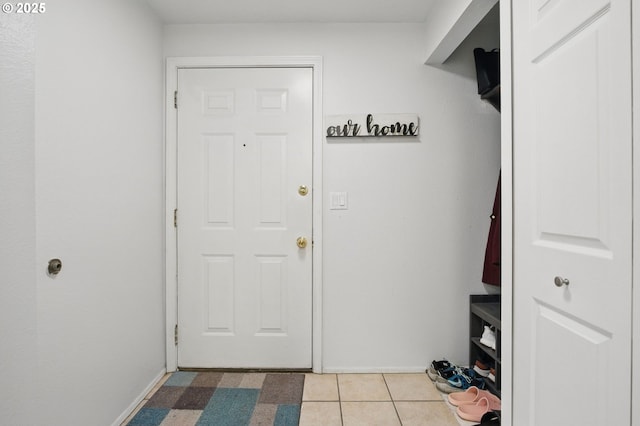doorway featuring light tile patterned floors