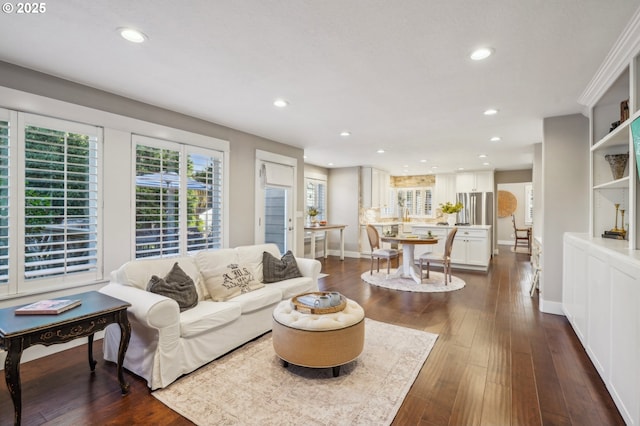 living room with baseboards, dark wood finished floors, and recessed lighting