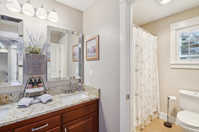 full bath with a shower with curtain, vanity, toilet, and baseboards