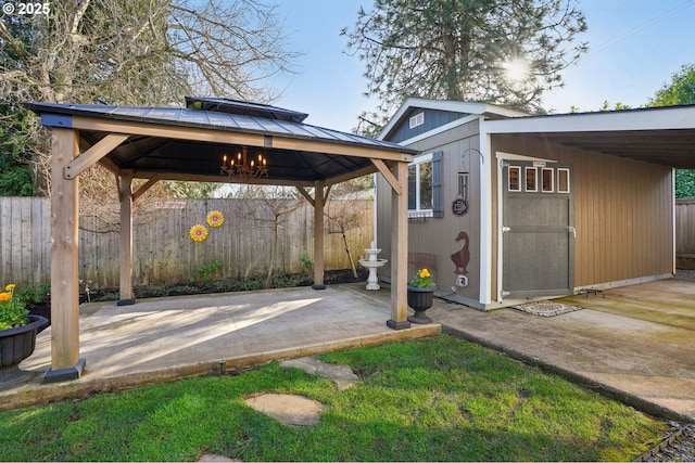 exterior space with fence and a gazebo