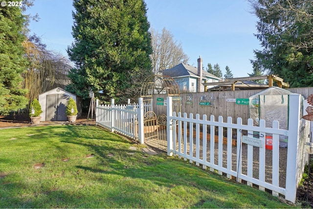 view of yard with an outbuilding, a shed, and fence