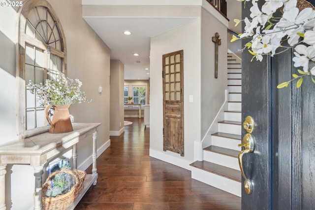 foyer entrance featuring recessed lighting, baseboards, stairway, and hardwood / wood-style floors