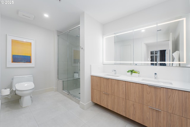 bathroom with a shower with door, vanity, tile patterned flooring, and toilet