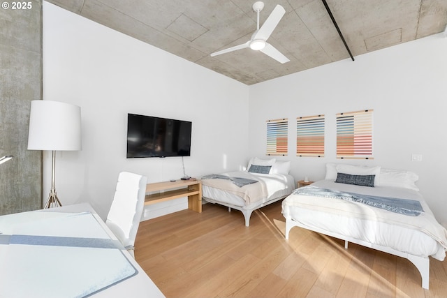 bedroom with light wood finished floors and ceiling fan