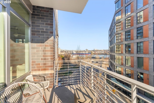 balcony featuring a water view