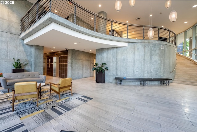 1255 NW 9th Ave Unit 411, Portland, OR 97209 - community lobby featuring a towering ceiling and recessed lighting