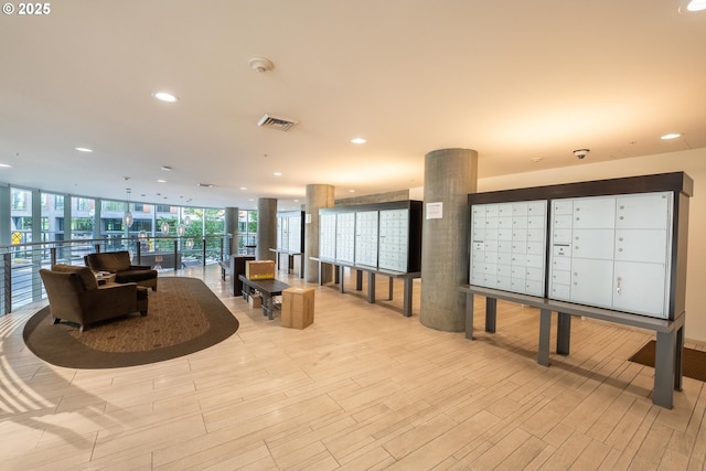 1255 NW 9th Ave Unit 411, Portland, OR 97209 - building lobby featuring floor to ceiling windows, recessed lighting, and a security system