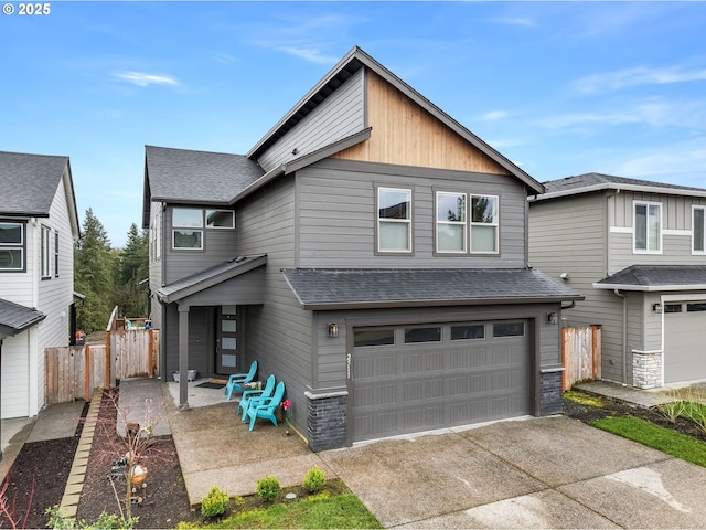 2511 S White Salmon Dr, Ridgefield, WA 98642 - view of front of home featuring a shingled roof, concrete driveway, and a garage