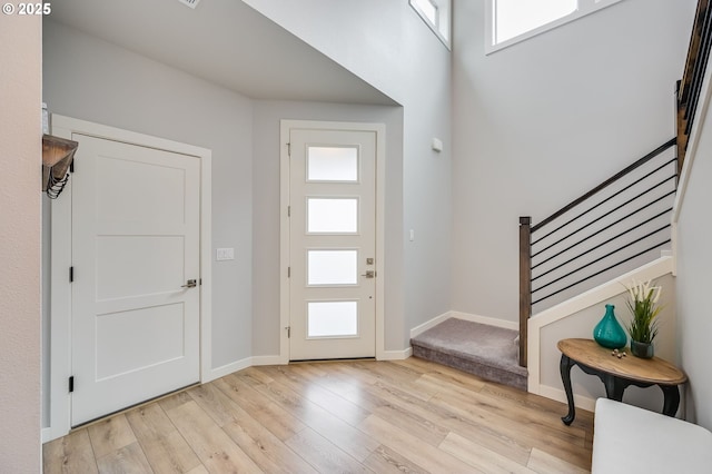 2511 S White Salmon Dr, Ridgefield, WA 98642 - entryway with healthy amount of natural light, stairway, and light wood-style flooring