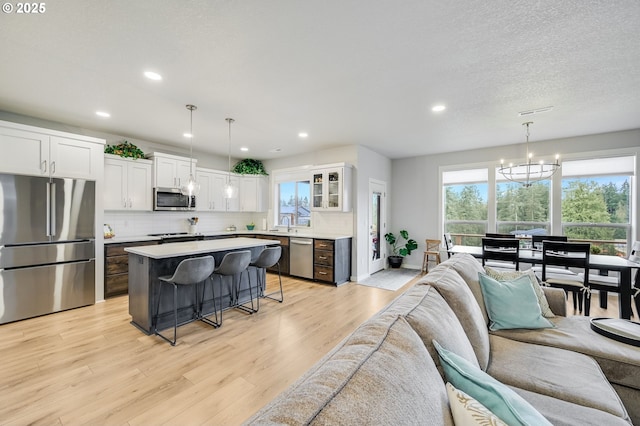 2511 S White Salmon Dr, Ridgefield, WA 98642 - living room featuring plenty of natural light, light wood-type flooring, and recessed lighting