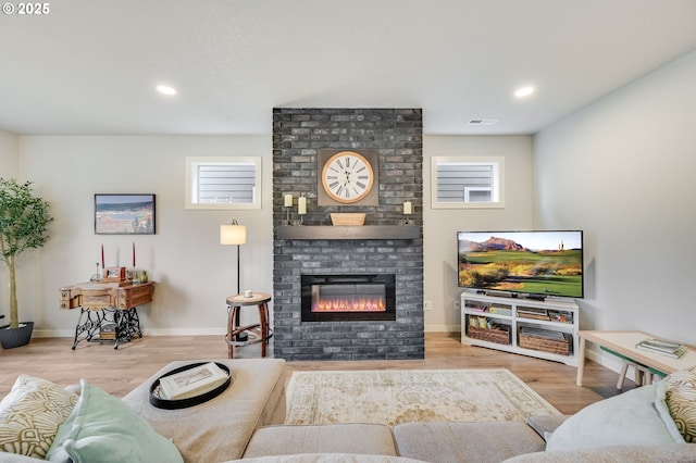 2511 S White Salmon Dr, Ridgefield, WA 98642 - living area with a brick fireplace, wood finished floors, and recessed lighting