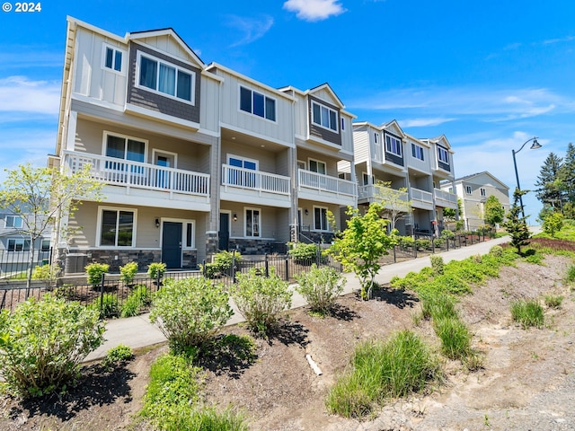 view of property with a residential view and fence