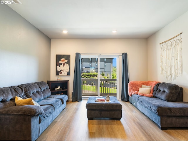 living room with recessed lighting and light wood-style floors