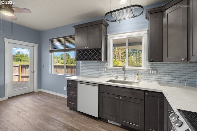 2820 23rd Pl, Forest Grove, OR 97116 - kitchen with white dishwasher, stove, tasteful backsplash, and ceiling fan