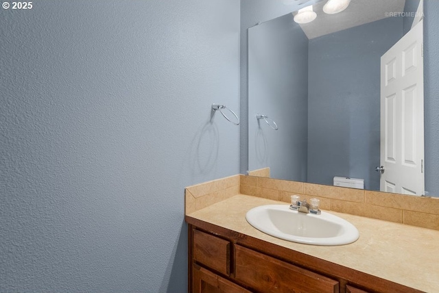 2820 23rd Pl, Forest Grove, OR 97116 - bathroom with vanity, toilet, and a textured wall