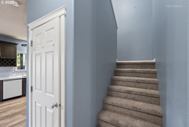 2820 23rd Pl, Forest Grove, OR 97116 - stairs with wood finished floors and a textured ceiling