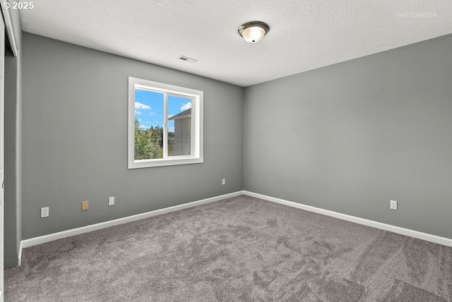 2820 23rd Pl, Forest Grove, OR 97116 - spare room with carpet, baseboards, and a textured ceiling
