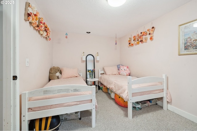 carpeted bedroom with baseboards