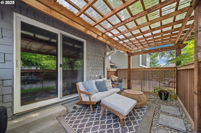 view of patio featuring a pergola and fence