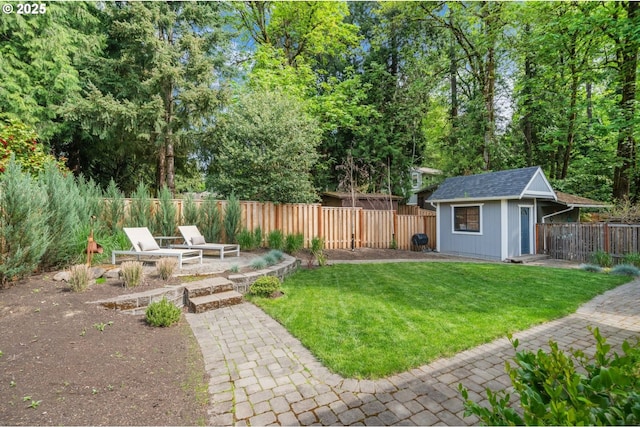 view of yard with an outdoor structure and a patio