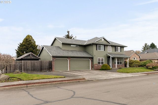 traditional home with brick siding, a shingled roof, aphalt driveway, and fence