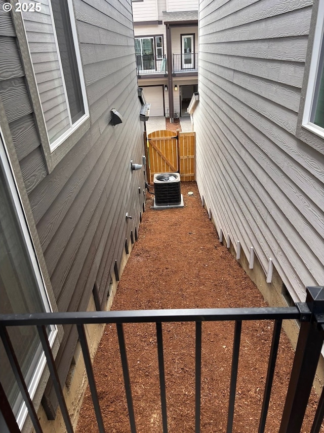 13981 SW 166th Ave, Tigard, OR 97223 - view of home's exterior with a cooling unit and a gate
