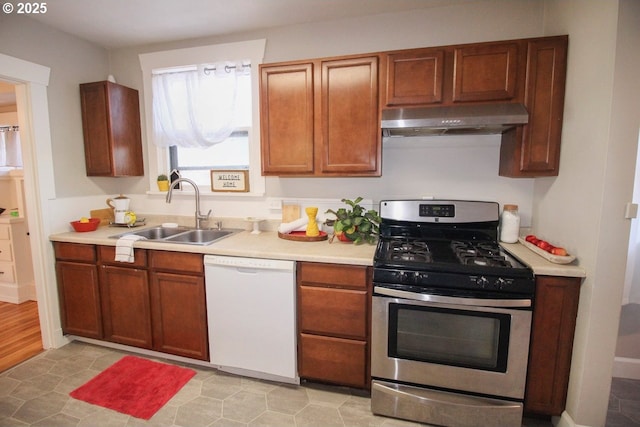 kitchen featuring sink, stainless steel range with gas stovetop, and dishwasher