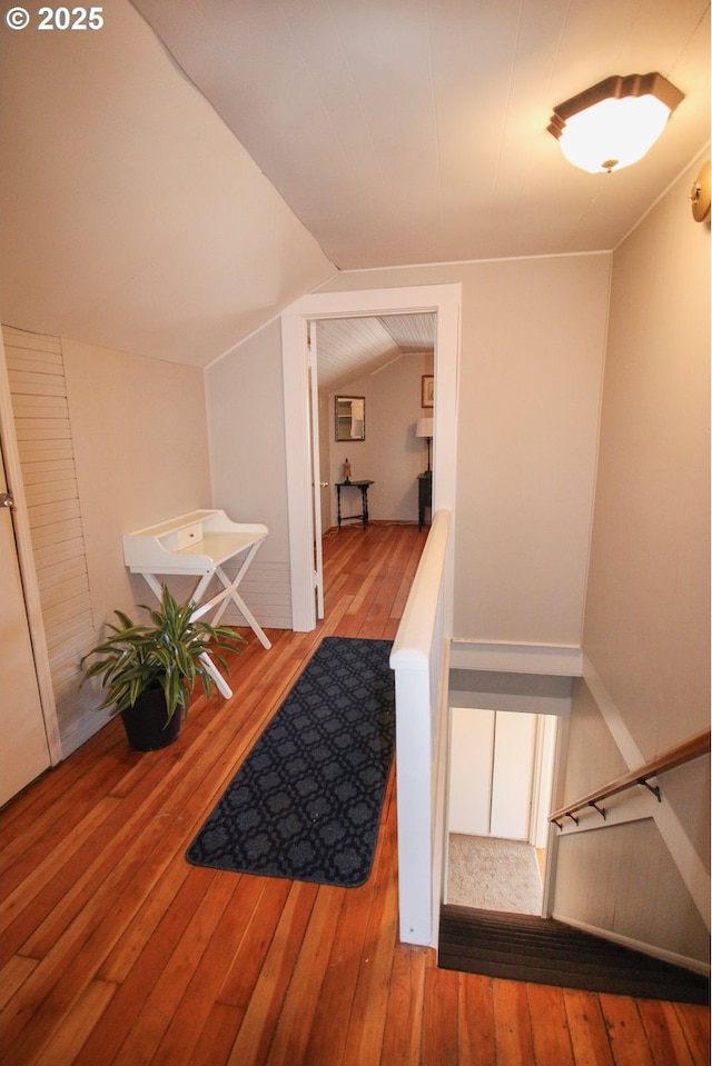 interior space featuring vaulted ceiling and hardwood / wood-style floors