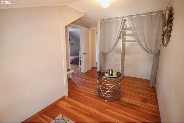 hall with wood-type flooring