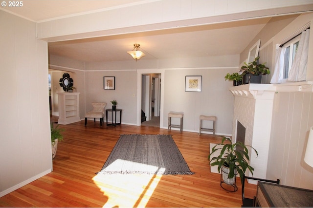 interior space with a fireplace and wood-type flooring