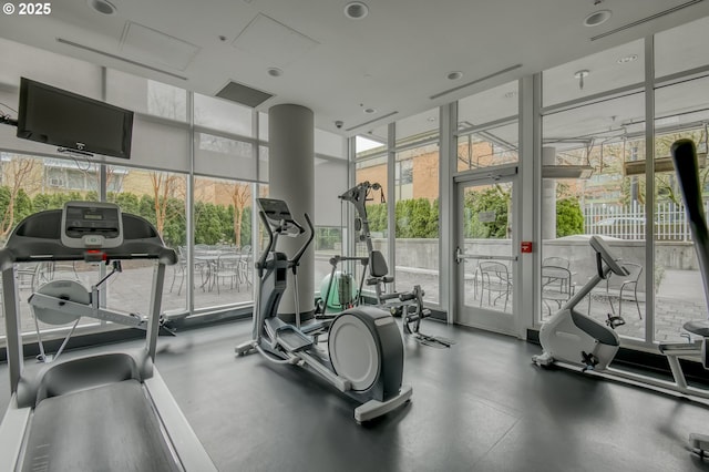 exercise room with floor to ceiling windows