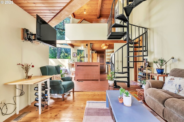 2696 Moon Mountain Dr, Eugene, OR 97403 - living area featuring a wooden ceiling with exposed beams, stairway, wood-type flooring, and high vaulted ceiling