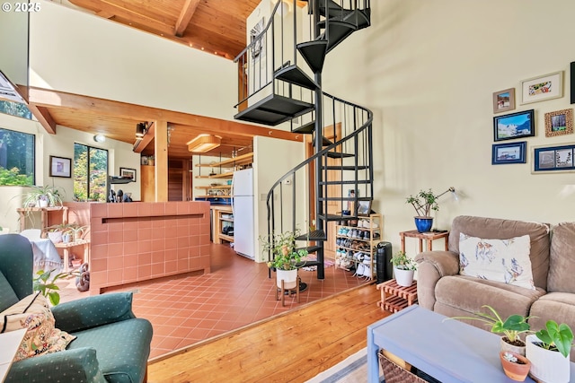2696 Moon Mountain Dr, Eugene, OR 97403 - living room with high vaulted ceiling, stairway, wood finished floors, and a wood ceiling with exposed beams