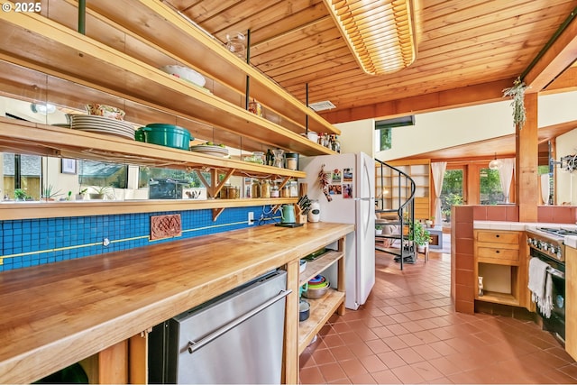 2696 Moon Mountain Dr, Eugene, OR 97403 - kitchen featuring open shelves, appliances with stainless steel finishes, wooden ceiling, and tile patterned floors