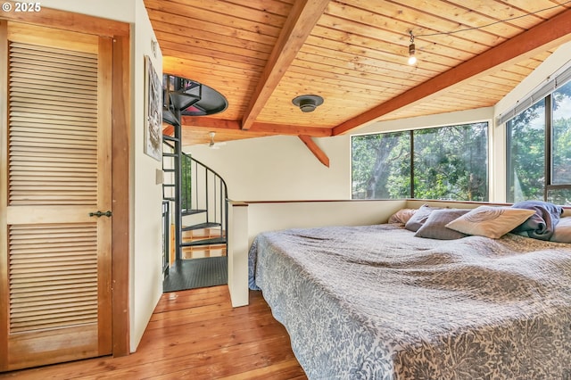2696 Moon Mountain Dr, Eugene, OR 97403 - bedroom with wood-type flooring and a wood ceiling with exposed beams