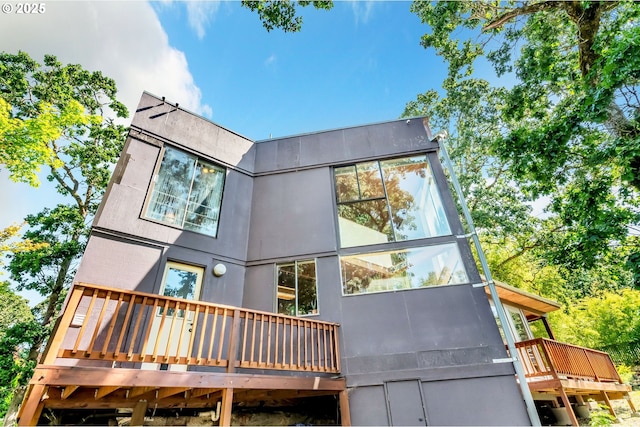2696 Moon Mountain Dr, Eugene, OR 97403 - rear view of house featuring a wooden deck and stucco siding