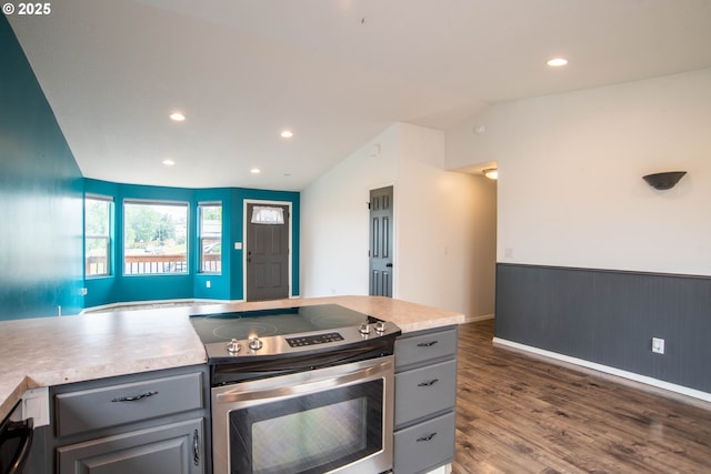 906 N Railroad Ave, Ridgefield, WA 98642 - kitchen with stainless steel range with electric stovetop, gray cabinetry, vaulted ceiling, dark wood-style flooring, and light countertops