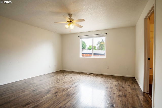 906 N Railroad Ave, Ridgefield, WA 98642 - spare room featuring ceiling fan, dark wood-type flooring, and a textured ceiling