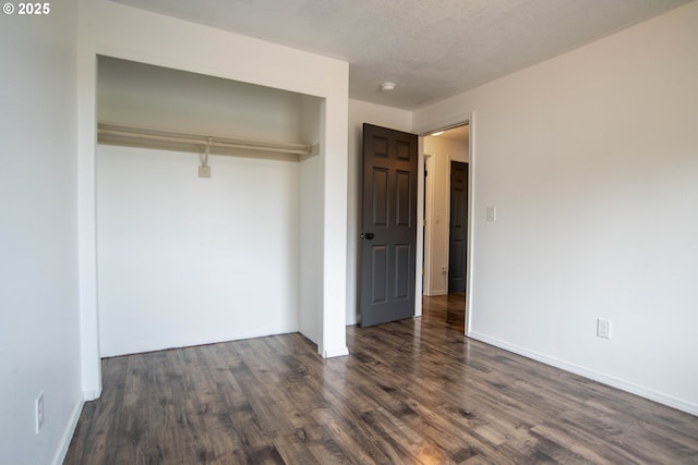 906 N Railroad Ave, Ridgefield, WA 98642 - unfurnished bedroom featuring a closet and dark wood finished floors