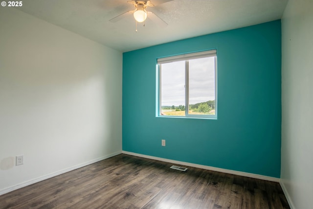 906 N Railroad Ave, Ridgefield, WA 98642 - unfurnished room featuring dark wood-style flooring and a ceiling fan