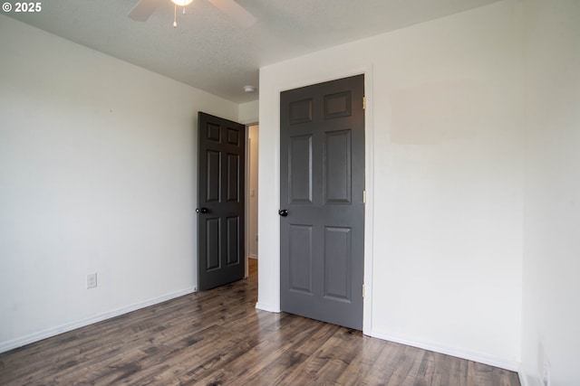 906 N Railroad Ave, Ridgefield, WA 98642 - spare room with dark wood finished floors, a ceiling fan, and a smoke detector