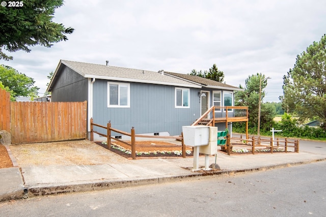 906 N Railroad Ave, Ridgefield, WA 98642 - ranch-style home with a wooden deck, crawl space, and roof with shingles