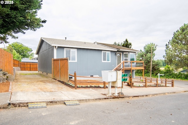 906 N Railroad Ave, Ridgefield, WA 98642 - ranch-style home featuring crawl space, a deck, and a shingled roof