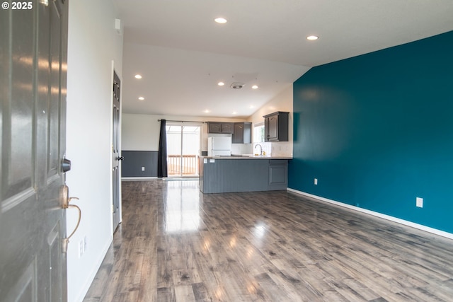 906 N Railroad Ave, Ridgefield, WA 98642 - unfurnished living room featuring lofted ceiling, dark wood-style flooring, and recessed lighting