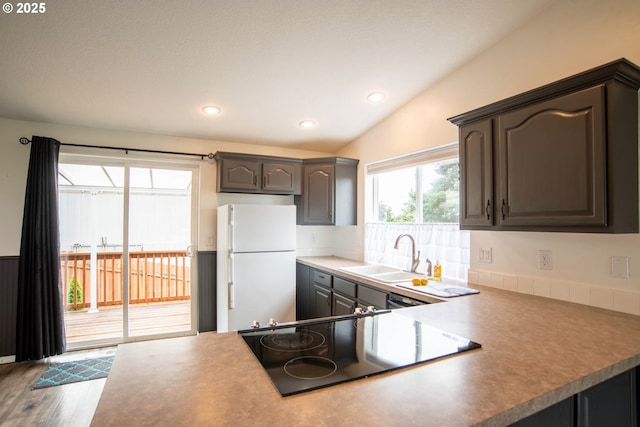 906 N Railroad Ave, Ridgefield, WA 98642 - kitchen featuring freestanding refrigerator, cooktop, recessed lighting, and wood finished floors