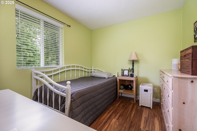 bedroom with wood finished floors