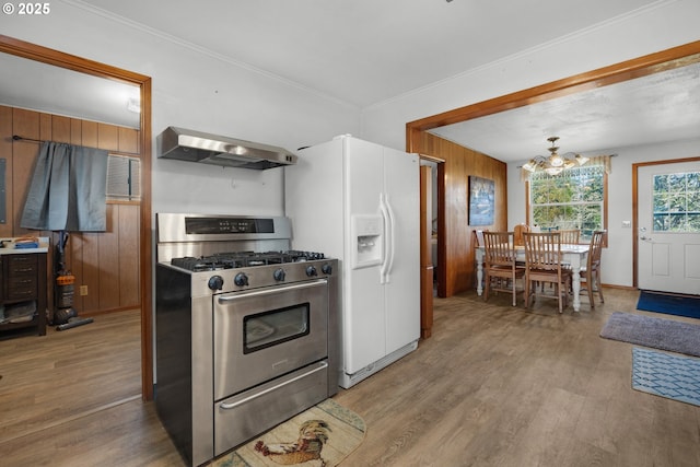 878 NW Warrenton Dr, Warrenton, OR 97146 - kitchen featuring wood finished floors, gas range, an inviting chandelier, and exhaust hood